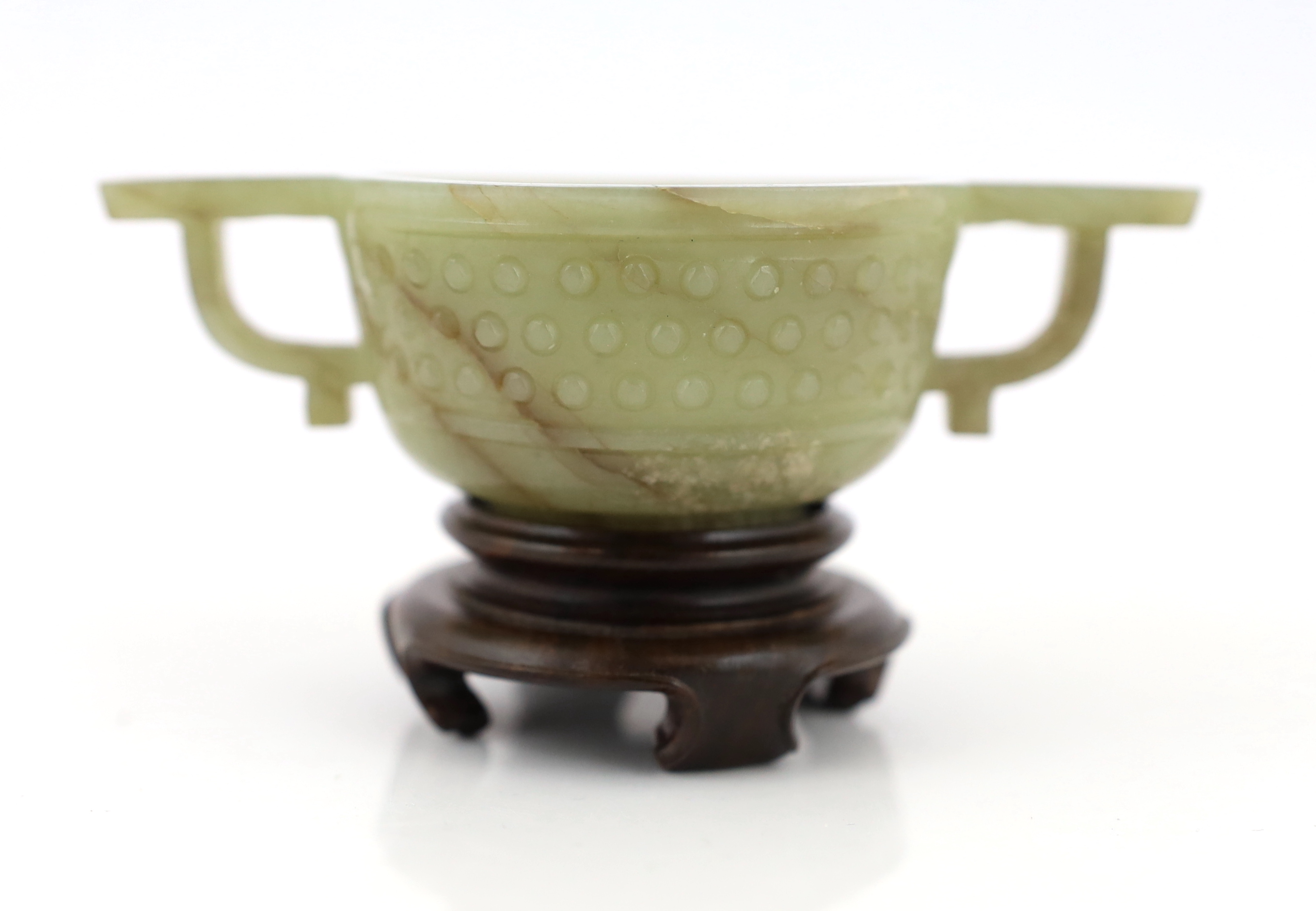 A Chinese celadon jade two handled cup, 17th century